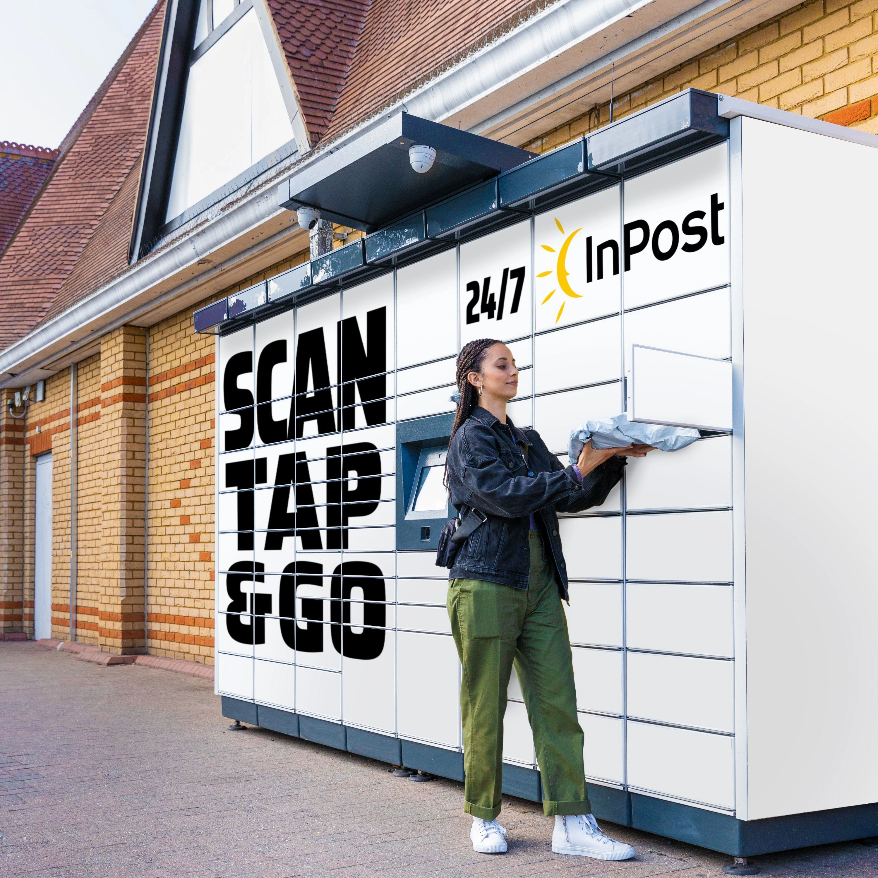 A woman receiving a parcel from InPost delivery locker